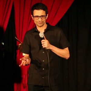 Comedian Rudy Ilyas performing on stage
