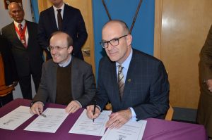 Ealing Council chief executive Paul Najsarek and Ryan Allain of Royal British Legion signing covenant