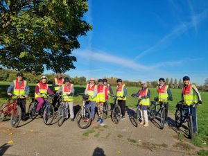 Cyclists in a row, smiling