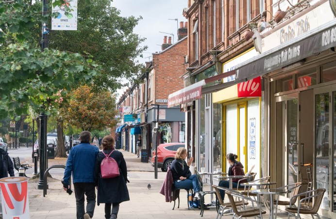 People walking down local high street - Pitshanger Lane