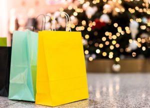 Gift bags next to a Christmas tree