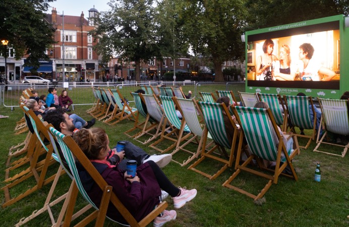 people watching film in pop-up outdoor cinema