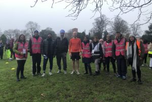 Volunteers and organises of the park run pose for a photo