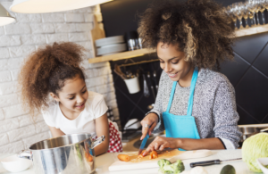 Mother and daughter cooking together