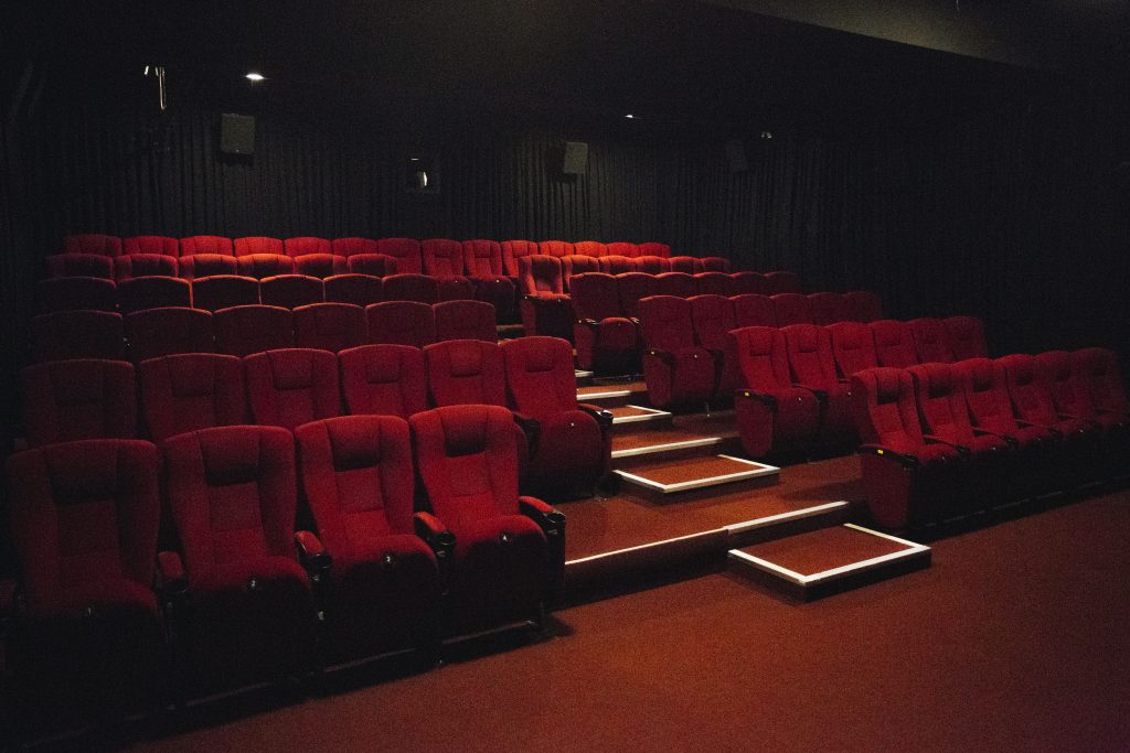 Rows of red seats in a cinema