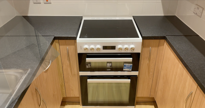 Cooker and hob inside one of the new kitchens at Poplars temporary accommodation unit