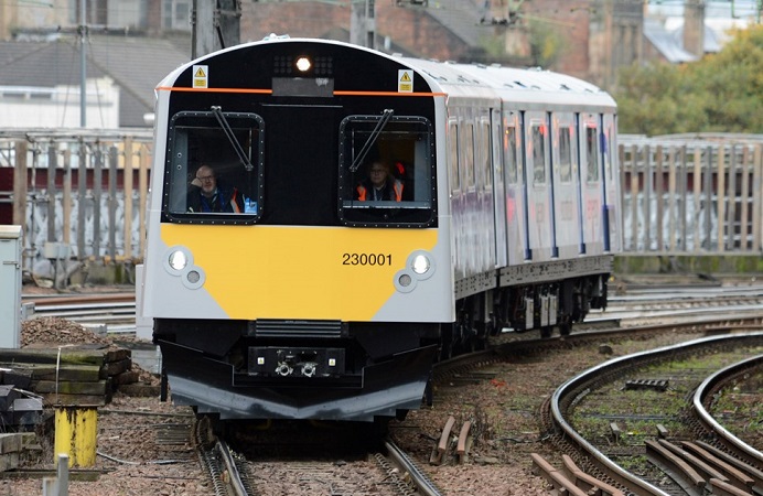 A train travelling in a residential area