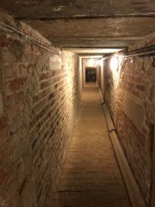 Dark, brickwork passage