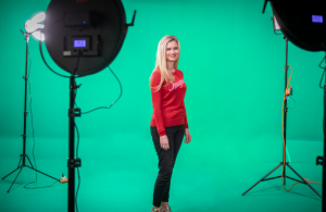 A woman smiling in a studio