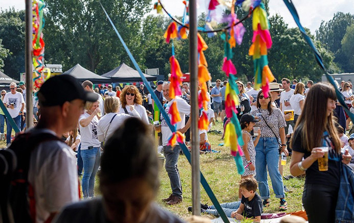 Crowds of people outdoors enjoying the Hanwell Hootie