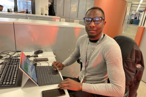 Animal licensing officer Shane seated at his desk in Ealing Council offices