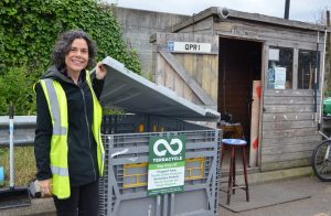 Councillor Deirdre Costigan standing next to the TerraCycle recycling bin at Greenford re-use and recycling centre