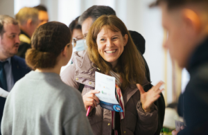 Smiling woman at a jobs fair