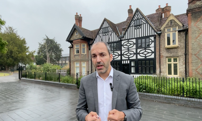 Councillor Bassam Mahfouz standing in front of Southall Manor House