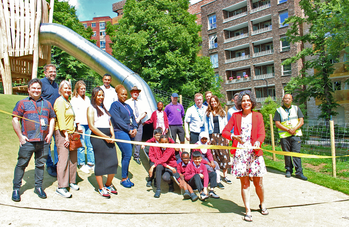 Councillor Costigan cutting the ribbon with local people at Mill Hill Park