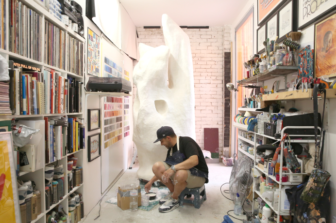 Artist David Samuel working on one of his sculptures at Excelsior Studios