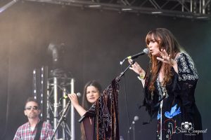 Singers on stage with microphones