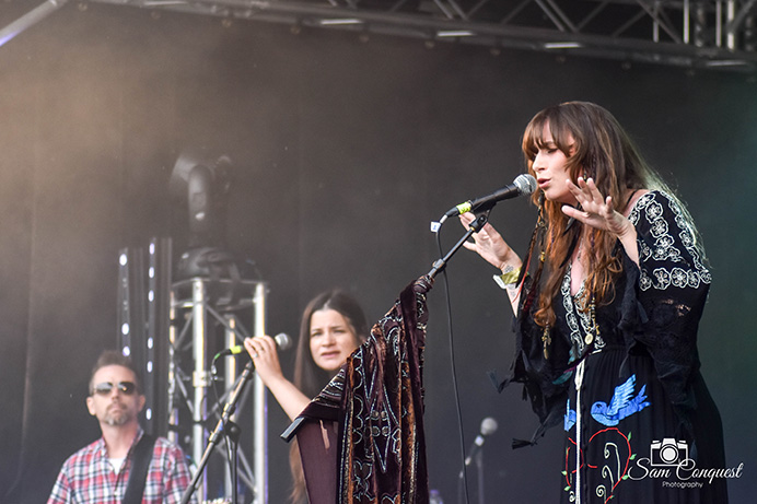 Singers on stage with microphones