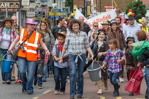 Group of people parading down a street