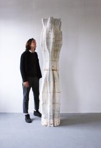 Pierre in BioBlast studio with a tree column furniture