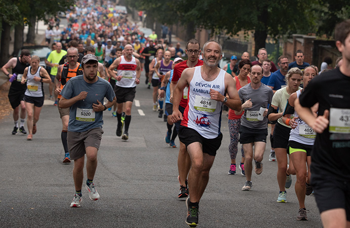 Runners running along a road at the Ealing Half Marathon