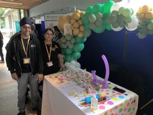 Taran Panesar of Super Duper Inflatables and Mindi Panesar of Happy Faces By Mindi standing by their stall at the Southall Business Expo
