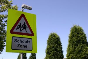 A sign warning drivers that a school is up ahead