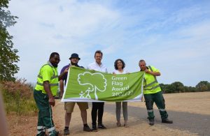 Councillors hold up the Green Flag