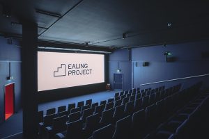 A cinema screen with rows of seats