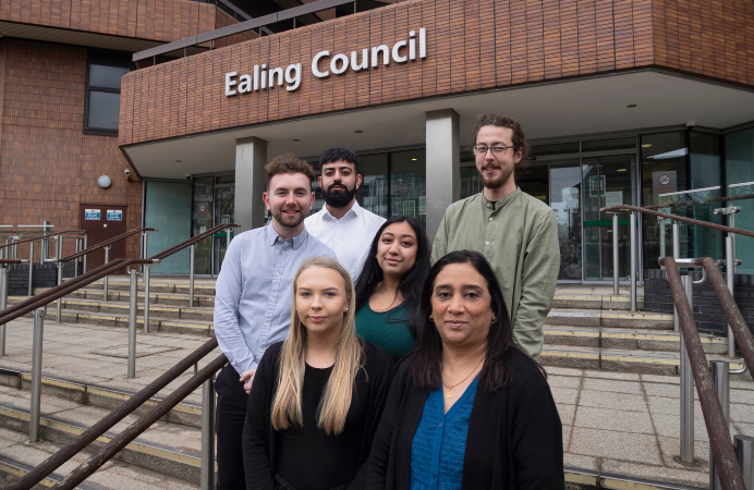 Six people standing on the steps of Ealing Council's Perceval House offices