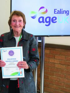 Lady holding a certificate and smiling