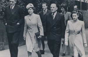 Group of people, formally dressed, walking together
