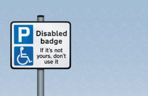A sign promoting blue badge parking