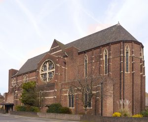 Exterior of a church, viewed from the roadside