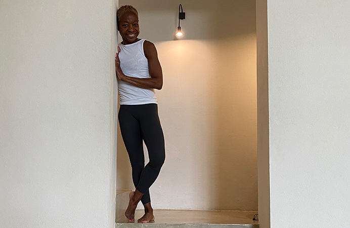 Woman standing at the top of a stairwell - fitness trainer Doreen Whittaker