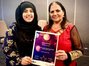 Mayor of Ealing presenting adult learner with achievement certificate