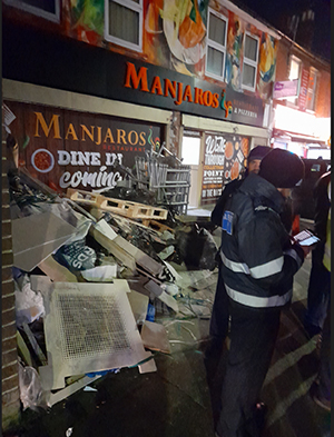 Officers checking fly-tipped waste