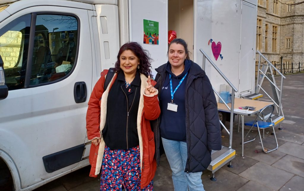 Cllr Aysha Raza with Beth from GMI Partnership at the HIV testing bus outside Ealing Town Hall