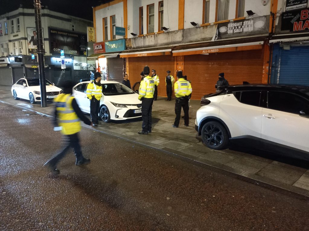 Council officers and police issuing parking fines at night