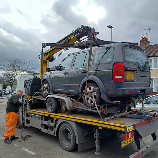 Car being towed on a truck