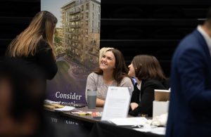 Employers talking to candidates at a jobs fair