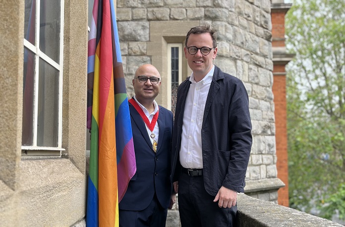 Pride flag next to Cllr Hitesh Tailor and Cllr Peter Mason