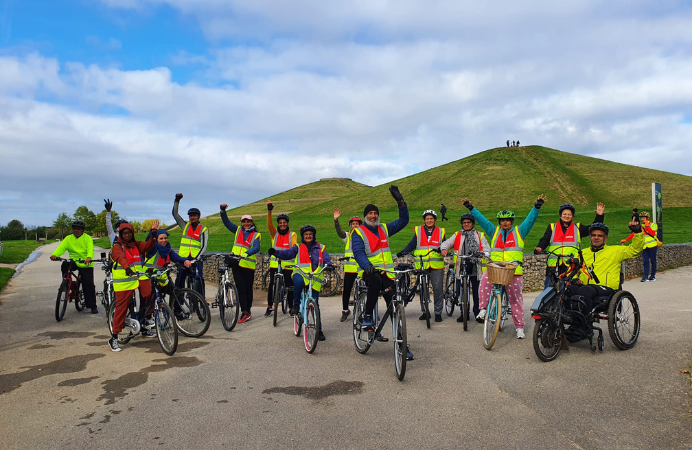 A group of adults on their bikes in front of Northala Fields