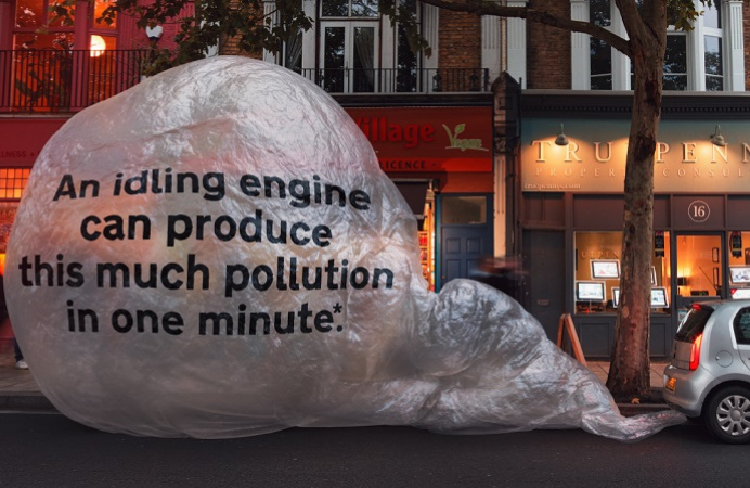 A car with a bubble at the back saying "and idling engine can produce this much pollution in one minute".