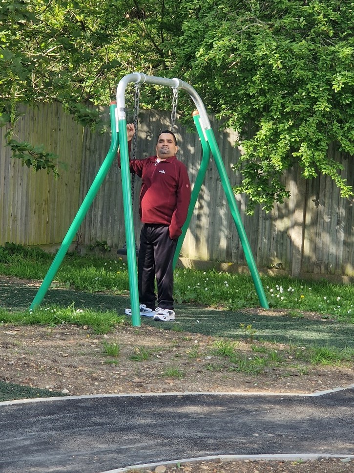 person on a swing at the short breaks garden