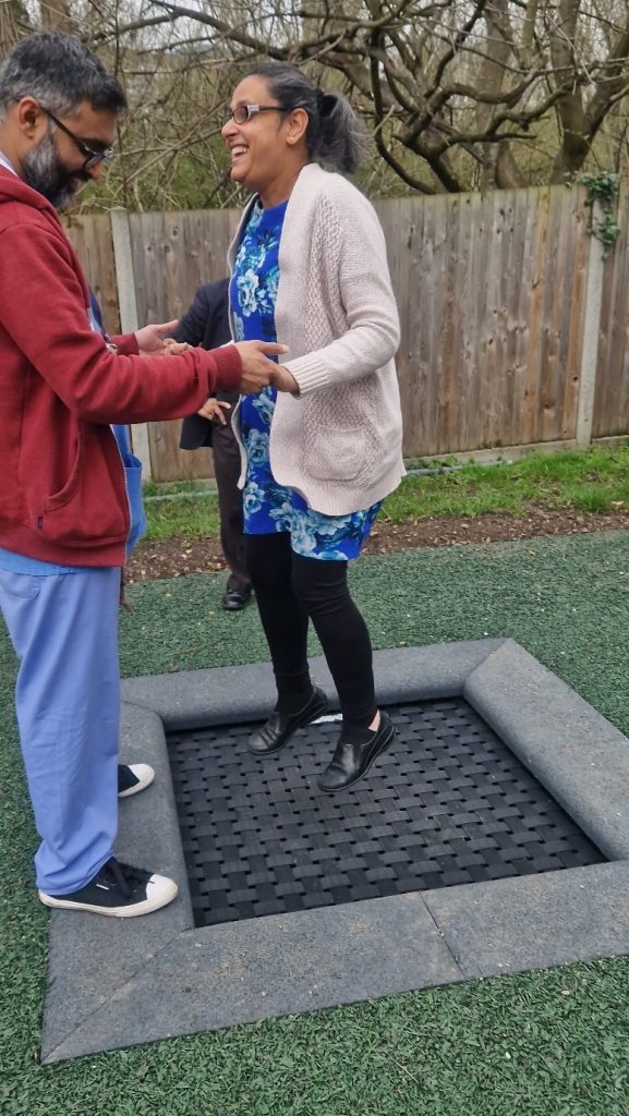 girl on trampoline at short breaks garden