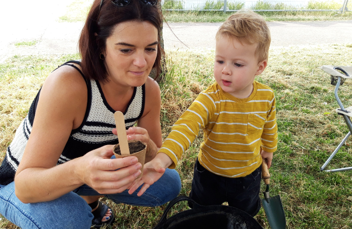 Mother and son attend wild flower plating event