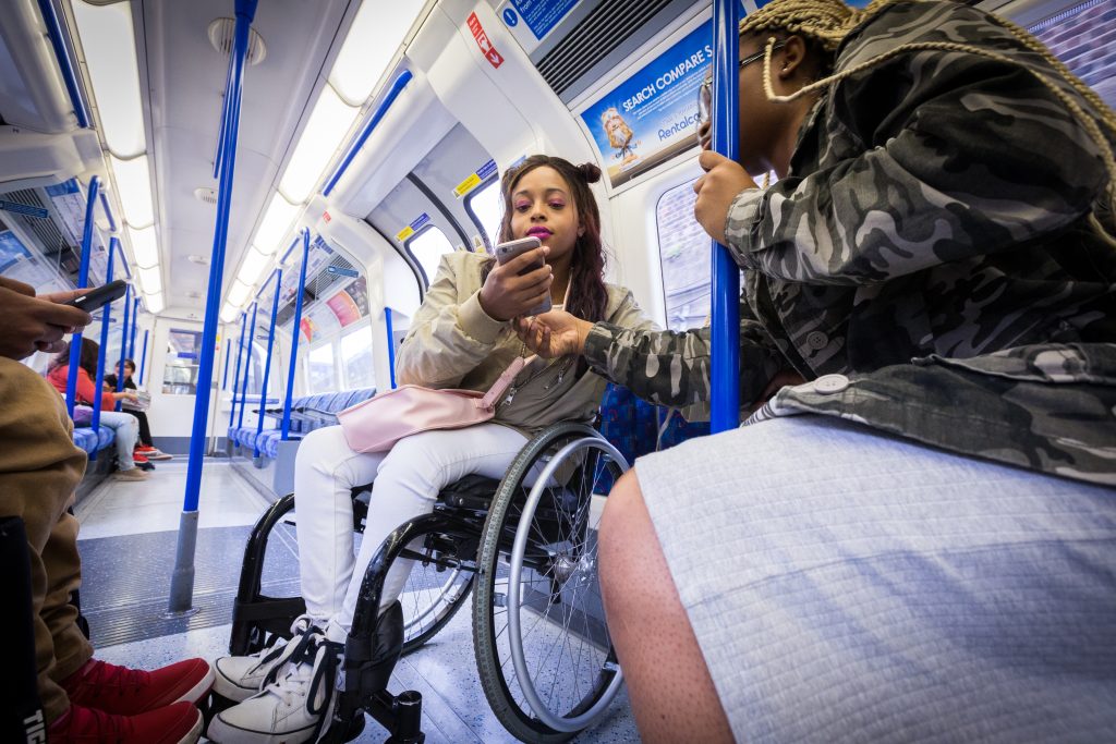 Wheelchair user on a tube train