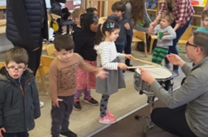 Children with drum teacher