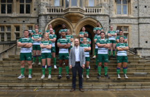Councillor Josh Blacker with female and male players from the rugby club on the steps of Ealing Town Hall